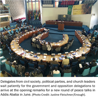 Delegates from civil society, political parties, and church leaders wait patiently for the government and opposition delegations to arrive at the opening remarks for a new round of peace talks in Addis Ababa in June.  