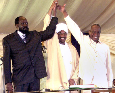 Southern Sudanese leader Salva Kiir Mayardit, left, raises hands with Sudan's President Omar al-Bashir, centre, and Vice President Ali Osman Mohammed Taha following his swearing-in ceremony as Sudan's first vice president in Khartoum in 2005. (AP)