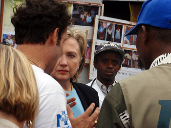Secretary Clinton is briefed by staff at the Mugunga camp for internally displaced people in eastern Congo. Courtesy of State Dept.