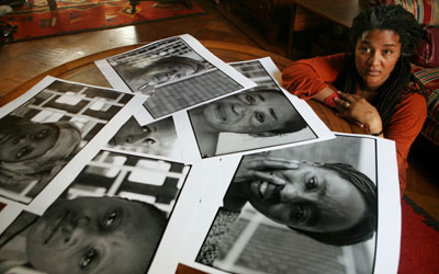 Playwright Lynn Nottage with photos of Congolese women (AP)