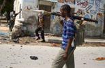 Militants patrol street in Mogadishu - AP
