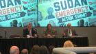 Rich Williamson, John Prendergast, and Eric Cohen speak on a panel at the summit
