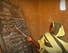 Teacher at Chalkboard